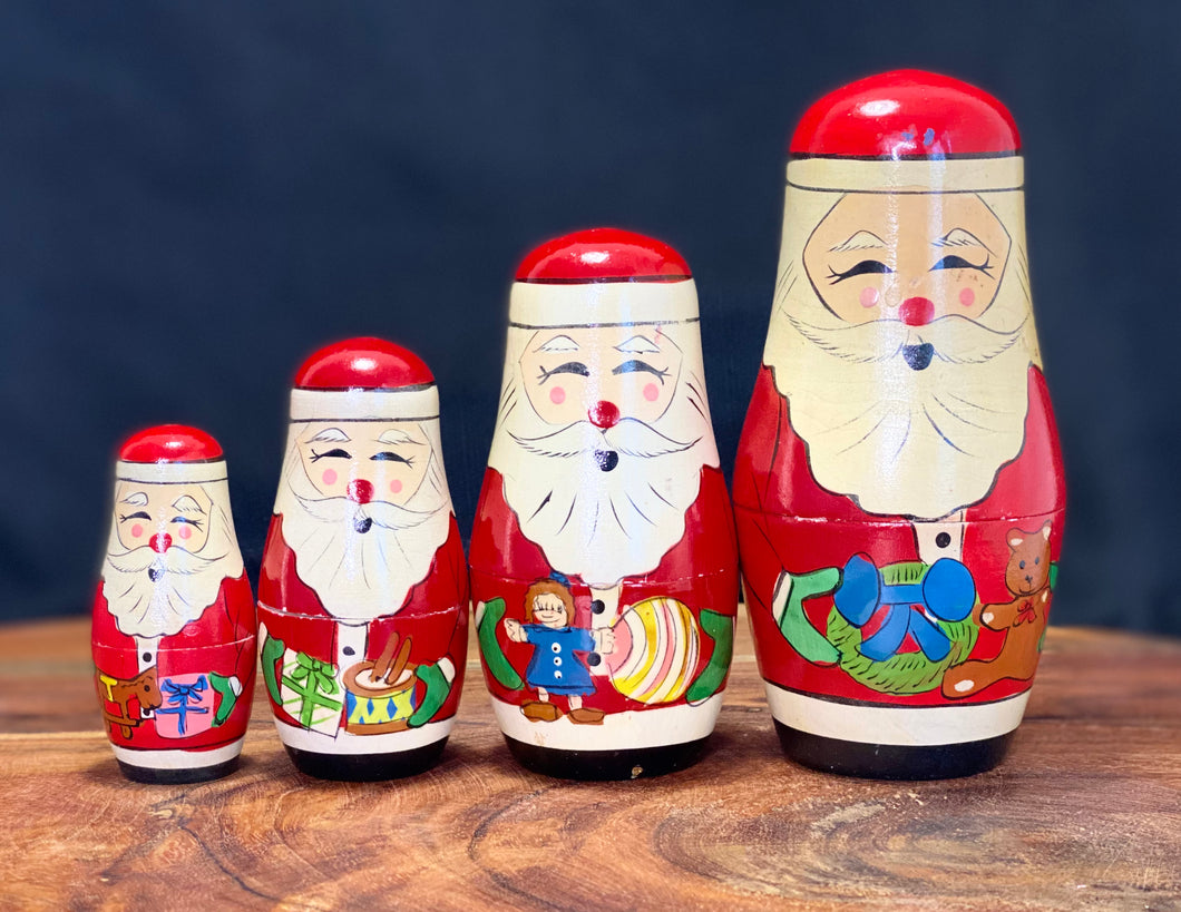 Vintage Christmas. 4 piece Nesting wooden Santa dolls.